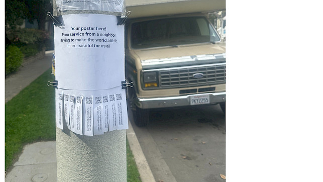 A poster on a street pole reads: "Your poster here! Free service from a neighbor trying to make the world a little more easeful for us all." Below the main text are tear-off tabs with QR codes and URLs. The poster is attached with binder clips, and a beige van is parked in the background.